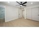 Bedroom showcasing wood-look flooring, closet, and a glimpse into the en-suite bathroom at 13446 N 18Th Ave, Phoenix, AZ 85029