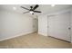 Bedroom featuring wood-look flooring, a closet, and ceiling fan with light at 13446 N 18Th Ave, Phoenix, AZ 85029