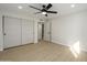 Bedroom with white walls and a closet with large, sliding doors at 13446 N 18Th Ave, Phoenix, AZ 85029