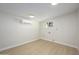 Well-lit laundry room with wood-look flooring and ample space at 13446 N 18Th Ave, Phoenix, AZ 85029