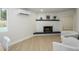 Living room features a white painted brick fireplace and grey accent chairs at 13446 N 18Th Ave, Phoenix, AZ 85029