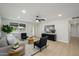 Bright living room featuring modern furniture, ceiling fan, and ample natural light at 13446 N 18Th Ave, Phoenix, AZ 85029