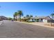 Charming home with a blue door, set in a friendly neighborhood with palm trees at 13446 N 18Th Ave, Phoenix, AZ 85029