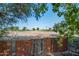 Expansive desert landscape view beyond a wooden fence, offering a serene and private outdoor space at 14264 S Baniff Ln, Arizona City, AZ 85123