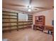 Bedroom with laminate flooring, ceiling fan, and shelving at 14264 S Baniff Ln, Arizona City, AZ 85123