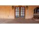 Close up of double front doors with decorative glass and the name Long Branch Saloon above at 14264 S Baniff Ln, Arizona City, AZ 85123