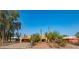 Home featuring unique Southwestern architecture and desert landscaping with mature Saguaro cacti at 14264 S Baniff Ln, Arizona City, AZ 85123