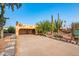 Charming front yard with desert landscaping and porte cochere-style covered parking area at 14264 S Baniff Ln, Arizona City, AZ 85123