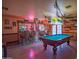 Fun game room with a pool table and a bar area at 14264 S Baniff Ln, Arizona City, AZ 85123