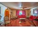 Cozy living room with decorative ceiling, hardwood floors, and ornate furniture at 14264 S Baniff Ln, Arizona City, AZ 85123