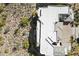 Aerial view of a modern house with a white roof and desert surroundings at 14850 E Grandview Dr # 226, Fountain Hills, AZ 85268