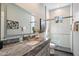 Modern bathroom featuring marble countertops, decorative art, and a glass-enclosed walk-in shower at 14850 E Grandview Dr # 226, Fountain Hills, AZ 85268