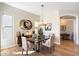 Elegant dining area with hardwood floors, a stylish chandelier, and a contemporary decor at 14850 E Grandview Dr # 226, Fountain Hills, AZ 85268