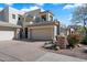 Elegant home featuring a spacious three-car garage, desert landscaping, and a charming stone mailbox post at 14850 E Grandview Dr # 226, Fountain Hills, AZ 85268