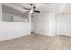 Open living space with tile flooring, a ceiling fan, and an open concept layout at 14946 W Caribbean Ln, Surprise, AZ 85379