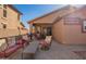 View of the backyard patio with comfortable seating, perfect for relaxation and enjoying the outdoors at 16150 W Hope Dr, Surprise, AZ 85379