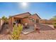 Backyard patio area with desert landscaping, perfect for outdoor enjoyment and relaxation at 16150 W Hope Dr, Surprise, AZ 85379