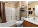 Neutral bathroom featuring a shower with glass doors and storage shelving at 16150 W Hope Dr, Surprise, AZ 85379