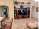 Inviting living room with a built-in entertainment center and neutral color palette at 16150 W Hope Dr, Surprise, AZ 85379