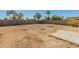 Large backyard with block wall fencing and ample space for landscaping at 16219 W Woodlands Ave, Goodyear, AZ 85338