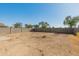 Large backyard with block wall fencing, ready for landscaping and recreation at 16219 W Woodlands Ave, Goodyear, AZ 85338