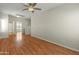 Spacious bedroom with ceiling fan, two windows and a closet at 16219 W Woodlands Ave, Goodyear, AZ 85338