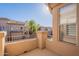 Balcony providing a bright view of the neighborhood buildings under a clear sky, complemented by a stucco exterior at 16420 N Thompson Peak Pkwy # 2120, Scottsdale, AZ 85260