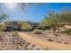 Scenic desert landscape with walking path and lush trees surrounding the property at 16420 N Thompson Peak Pkwy # 2120, Scottsdale, AZ 85260