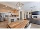 Open concept dining area adjacent to a modern kitchen and a comfortable living space, perfect for entertaining at 16420 N Thompson Peak Pkwy # 2120, Scottsdale, AZ 85260