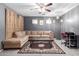 Inviting living room featuring a plush sectional sofa, decorative rug, and ample natural light at 16528 W Pierce St, Goodyear, AZ 85338