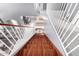 View down a wood-tread staircase into a home's living areas at 16528 W Pierce St, Goodyear, AZ 85338