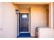 Inviting front door with decorative glass and neutral paint, with open storm door at 17217 E Calaveras Ave, Fountain Hills, AZ 85268