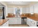 Bright kitchen with stainless steel appliances and white cabinets at 17217 E Calaveras Ave, Fountain Hills, AZ 85268