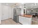 Kitchen island and fridge, with view of the dining room at 17217 E Calaveras Ave, Fountain Hills, AZ 85268