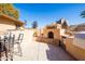 Outdoor kitchen featuring a built-in barbeque, bar seating, and desert landscaping at 17217 E Calaveras Ave, Fountain Hills, AZ 85268