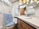 Clean bathroom with a shower, toilet, and a white countertop sink vanity at 177 S Limestone Dr, Apache Junction, AZ 85119