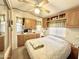 Cozy bedroom featuring a bed, overhead cabinets, and a built-in vanity with lots of storage at 177 S Limestone Dr, Apache Junction, AZ 85119