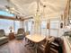 Open dining area with a pendant light, warm wood accents, and a view to the outdoor patio at 177 S Limestone Dr, Apache Junction, AZ 85119