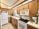 Functional kitchen featuring white appliances, light oak cabinets, and a cozy design at 177 S Limestone Dr, Apache Junction, AZ 85119