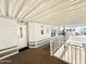 Covered front porch with a white door, providing shade and a welcoming entrance at 177 S Limestone Dr, Apache Junction, AZ 85119