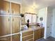 Spare room featuring built in cabinets, a countertop, and colorful decorations at 177 S Limestone Dr, Apache Junction, AZ 85119