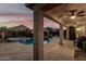 Inviting backyard featuring a sparkling pool, hot tub, and covered patio, perfect for relaxation and entertaining at 17793 W Corrine Dr, Surprise, AZ 85388