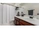 Inviting bathroom with classic vanity, decorative accents, and bright lighting at 17793 W Corrine Dr, Surprise, AZ 85388