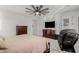 Bright bedroom featuring a ceiling fan, dresser, and access to a private patio at 17793 W Corrine Dr, Surprise, AZ 85388