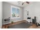 Bedroom featuring ceiling fan, wood floors and bright window with views at 17793 W Corrine Dr, Surprise, AZ 85388