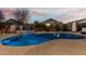 Inviting backyard pool and hot tub combination perfect for outdoor entertainment and relaxation at sunset at 17793 W Corrine Dr, Surprise, AZ 85388