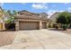 Stunning two-story home with three-car garage and extended driveway for extra parking at 18118 W Golden Ln, Waddell, AZ 85355