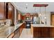 A gourmet kitchen featuring stainless steel appliances, a kitchen island and adjacent dining area at 18118 W Golden Ln, Waddell, AZ 85355