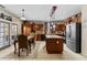 A gourmet kitchen featuring stainless steel appliances, a kitchen island and adjacent dining area at 18118 W Golden Ln, Waddell, AZ 85355