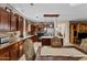 A gourmet kitchen featuring stainless steel appliances, a kitchen island and adjacent dining area at 18118 W Golden Ln, Waddell, AZ 85355